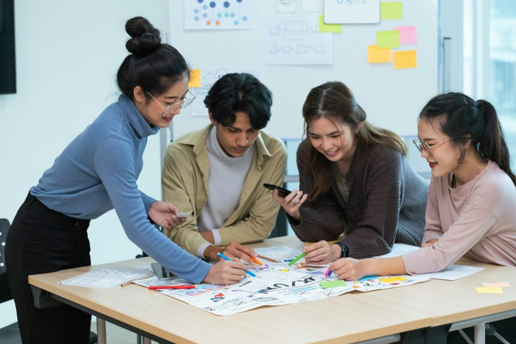 creative digital development agency brainstorming about mobile app interface wireframe design on